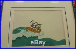 Disney production cel Huey, Dewey, and Louie surfing, framed